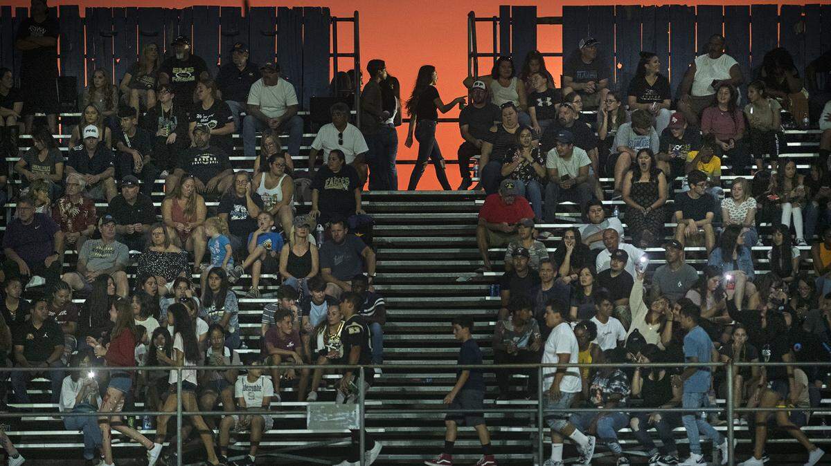Enochs fans watch the contest between Beyer and Enochs at Downey High School in Modesto, Calif., Friday, Aug. 23, 2019.