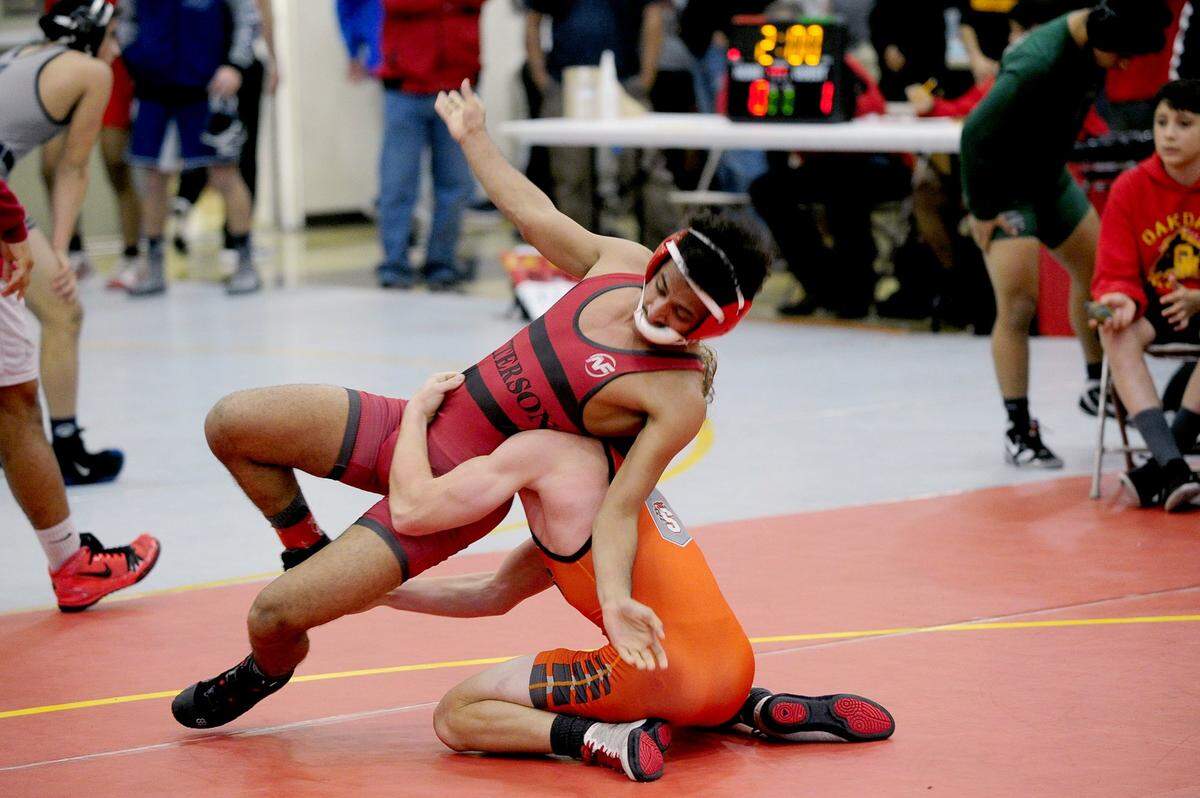 Patterson wrestler Mokbel Obeid loses his balance against Summerville wrestler Brennan Dibble, on Saturday, December 9, during the James Riddle Memorial Wrestling Tournament at Oakdale High School.