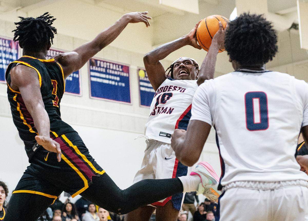 Modesto Christian’s BJ Davis scores during the Modesto Christian Holiday Hoop Classic championship game with Clovis West at Modesto Christian High School in Salida, Calif., Friday, Dec. 30, 2022. MC won the game 79-55.