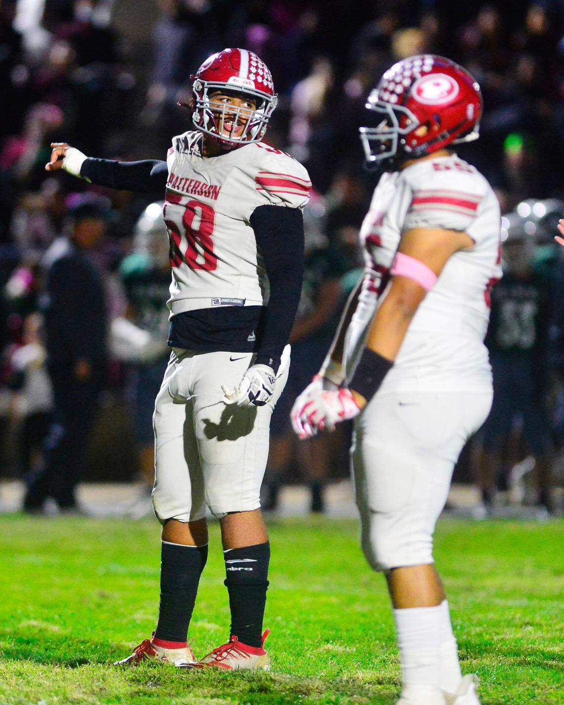 Patterson defensive lineman Marcus Simien (58) motions to his teammates during a game between Patterson and Central Valley high schools at Ceres High in Ceres, California, on Oct. 8, 2021.