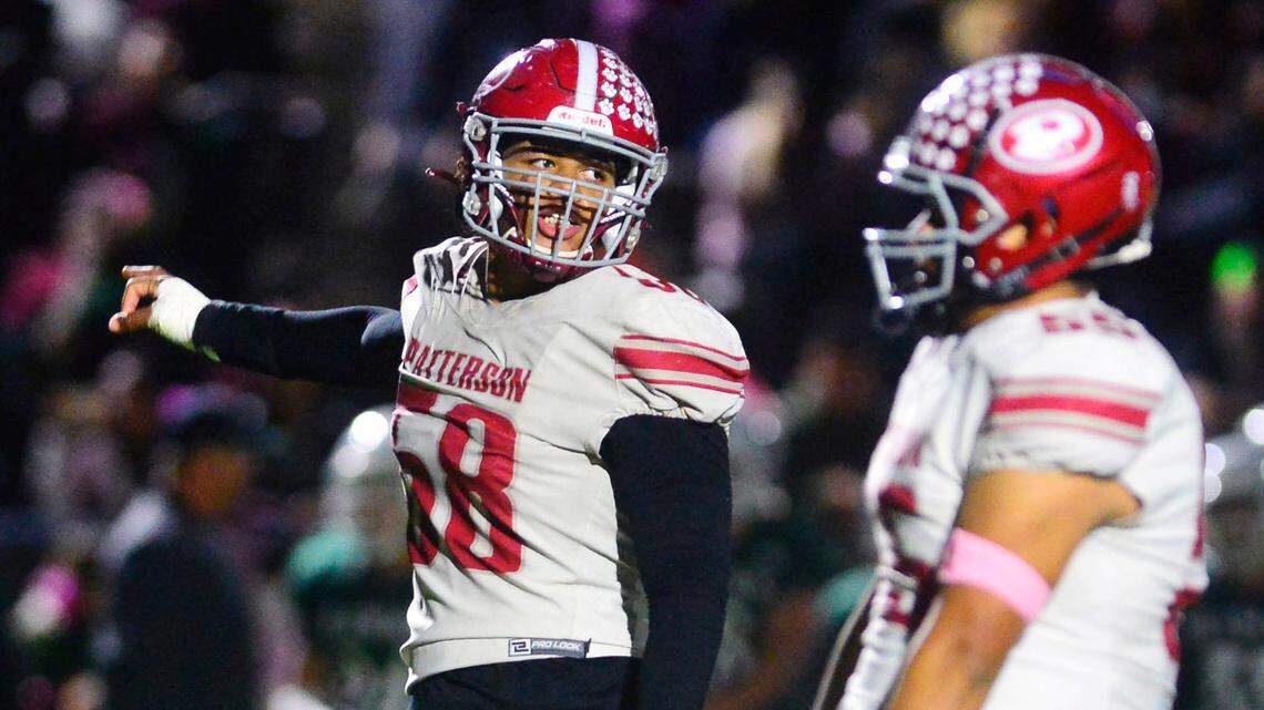Patterson defensive lineman Marcus Simien (58) motions to his teammates during a game between Patterson and Central Valley high schools at Ceres High in Ceres, California, on Oct. 8, 2021.