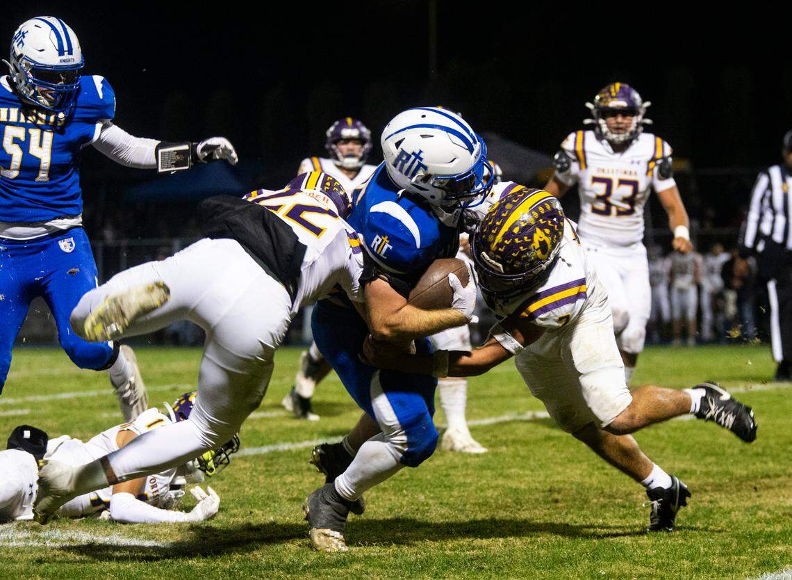 Ripon Christian’s Grant Sonke (25) gets sandwiched between Orestimba defenders in the Sac-Joaquin Section Division VII-A Championship against Orestimba at Ripon Christian High School on Friday, Nov. 17, 2023.