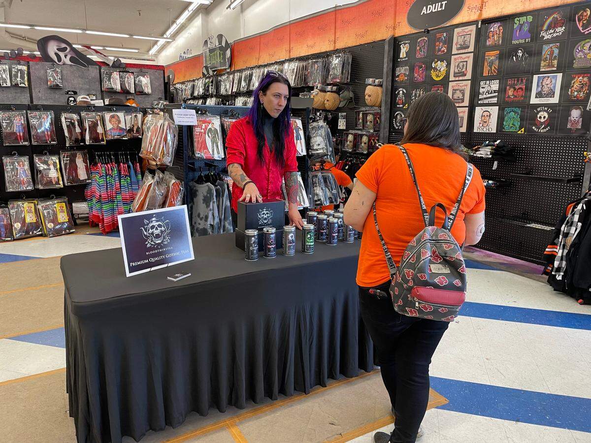 Social media personality Hyde, real name Joseph Zuzula, with his tea brand BloodThirsTea speaking to customers at a signing and sales event at Spirit Halloween Store on McHenry Ave. in Modesto on Saturday, Oct. 19, 2024.