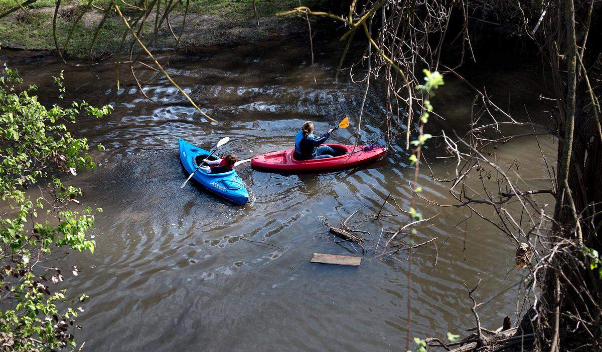 A pair kayak along Dry Creek near the confluence with the Tuolumne River during Rec Fest at Tuolumne River Regional Park in Modesto, Calif., on Saturday, March 17, 2018.