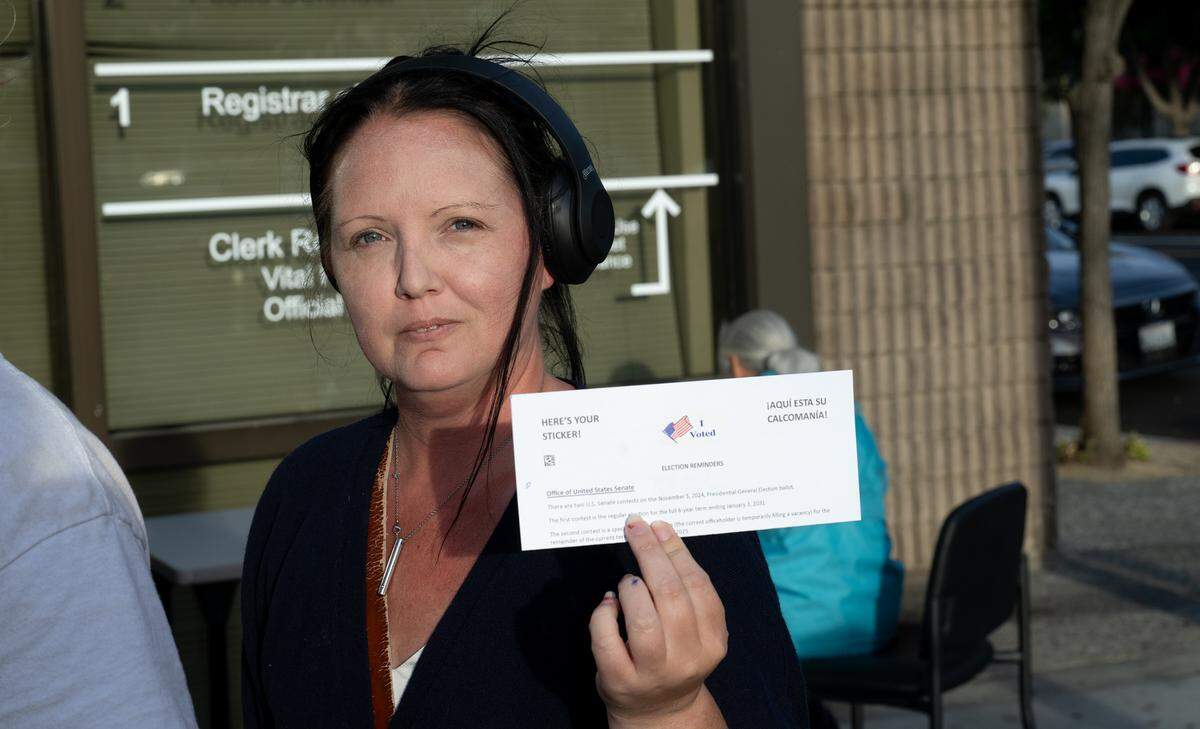 Jennifer Williams exits the Stanislaus County Registrar of Voters office after voting in Modesto, Tuesday, Nov. 5, 2024.
