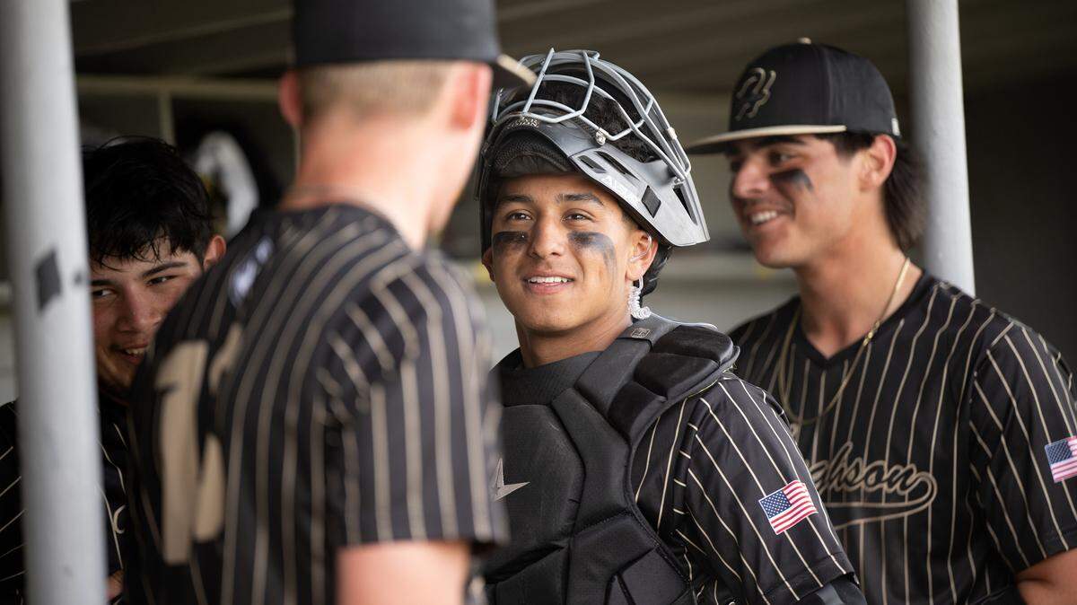 Hughson catcher JC Lupercio talks with teammates during a Trans Valley League game with Orestimba in Hughson, Calif., Friday, March 28, 2025.