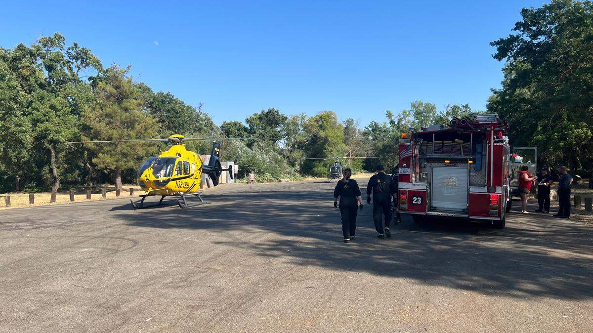 Modesto Firefighters rescue a woman from the Tuolumne River in La Grange on June 28, 2023