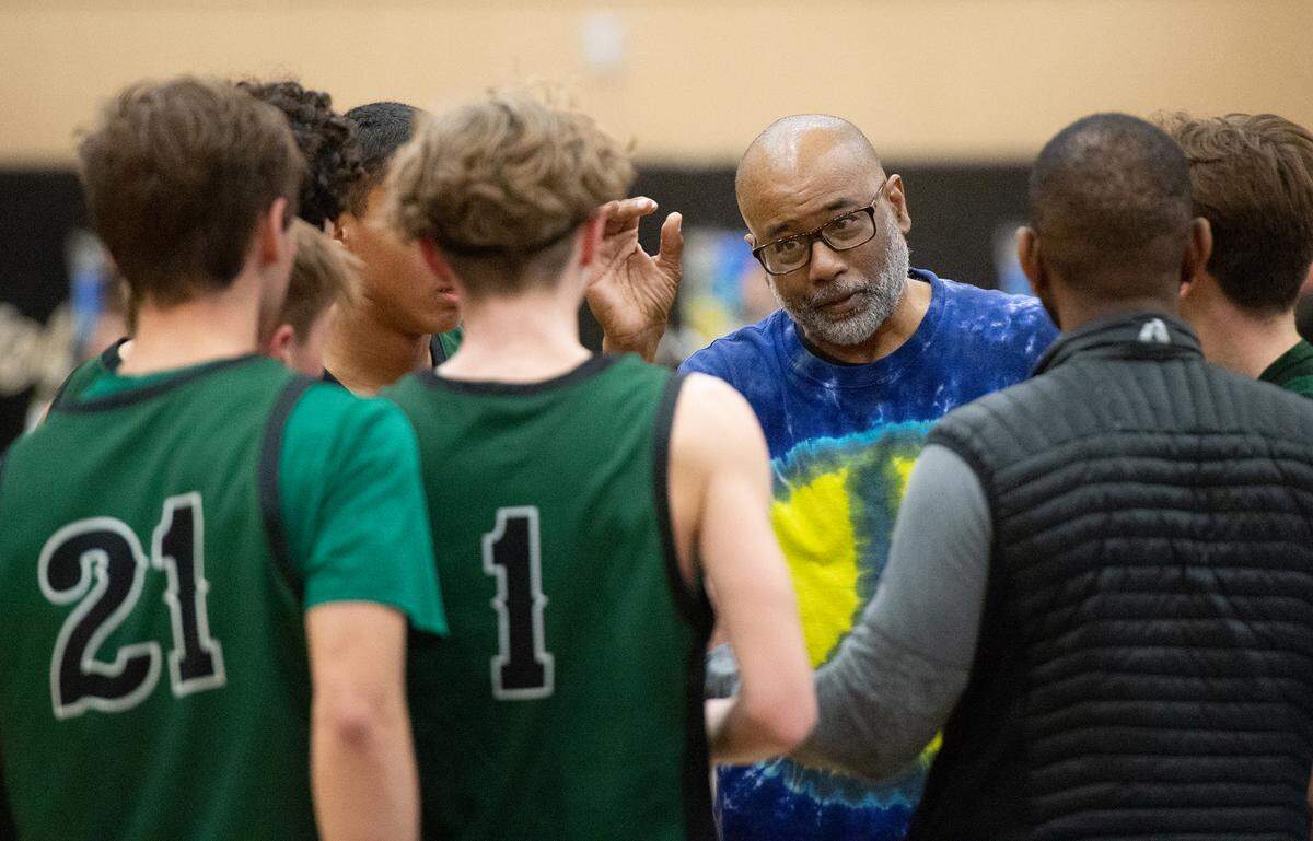 Pitman head coach Harvey Marable talks with his players during a fourth quarter time out in the Central California Athletic League game with Pitman at Enochs High School in Modesto, Calif., Friday, Feb. 10, 2023.