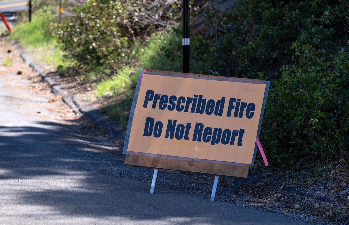 Firefighter work a prescribed burn along Highway 108 in the Stanislaus National Forest near Strawberry, Calif., on Friday, May 20, 2022.
