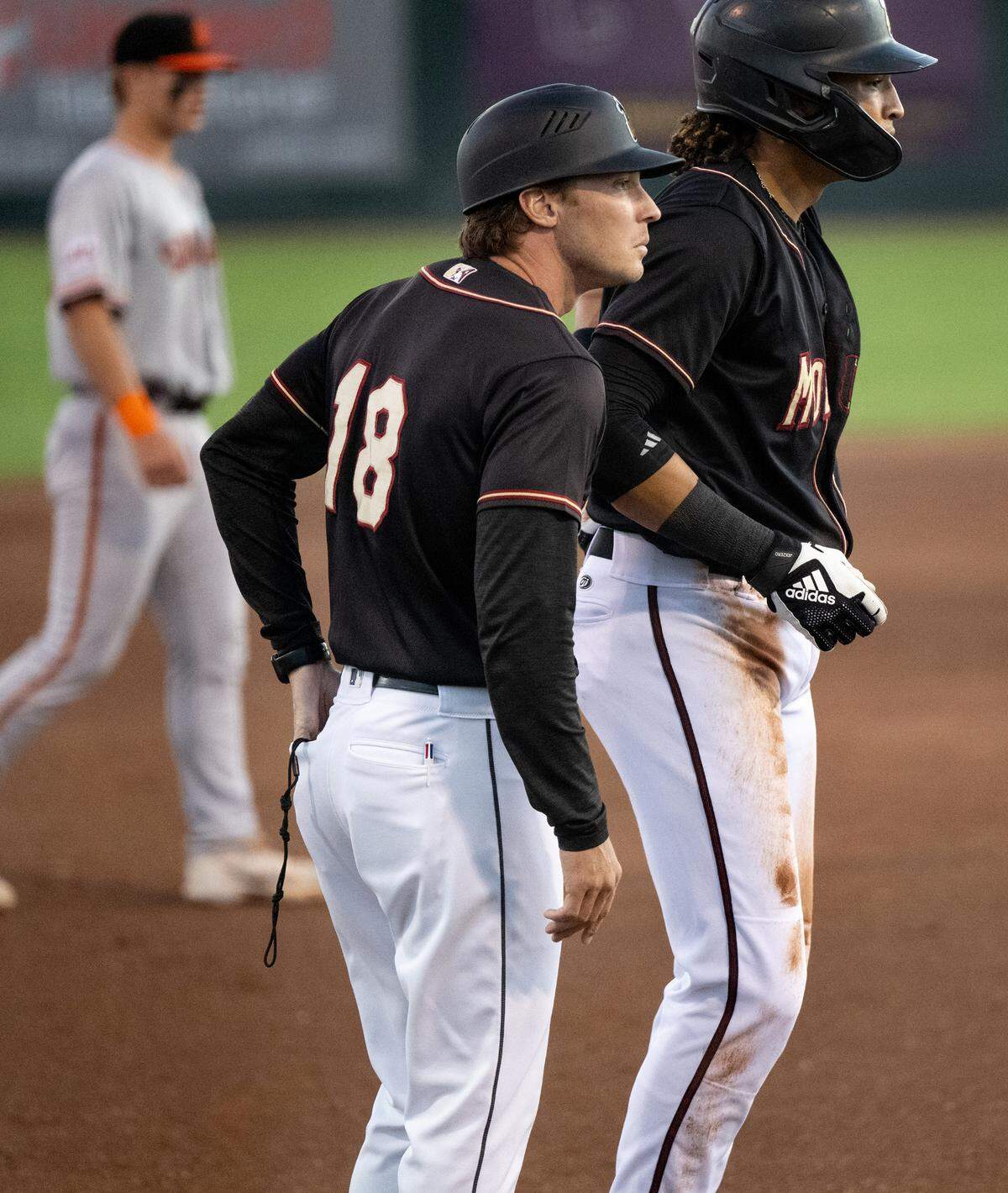 Modesto Nuts manager Zach Vincej coaches third base during the California League North Division series game with the San Jose Giants at John Thurman Field in Modesto, Calif., Thursday, Sept. 12, 2024.
