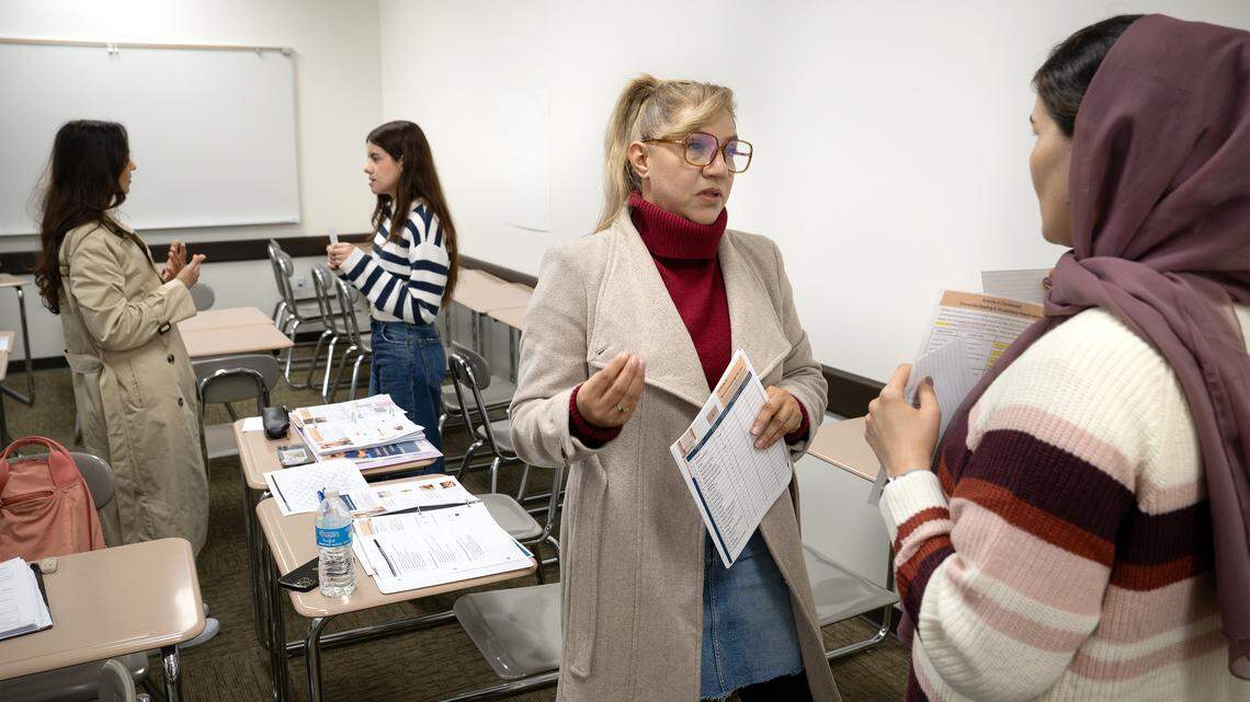 Ana Torres, left, and Mahwash Rasooli participate in an exercise to identify symptoms in patients during a English language class for nursing assistant students at Modesto Junior College in Modesto, Wednesday, Nov. 26, 2025. 