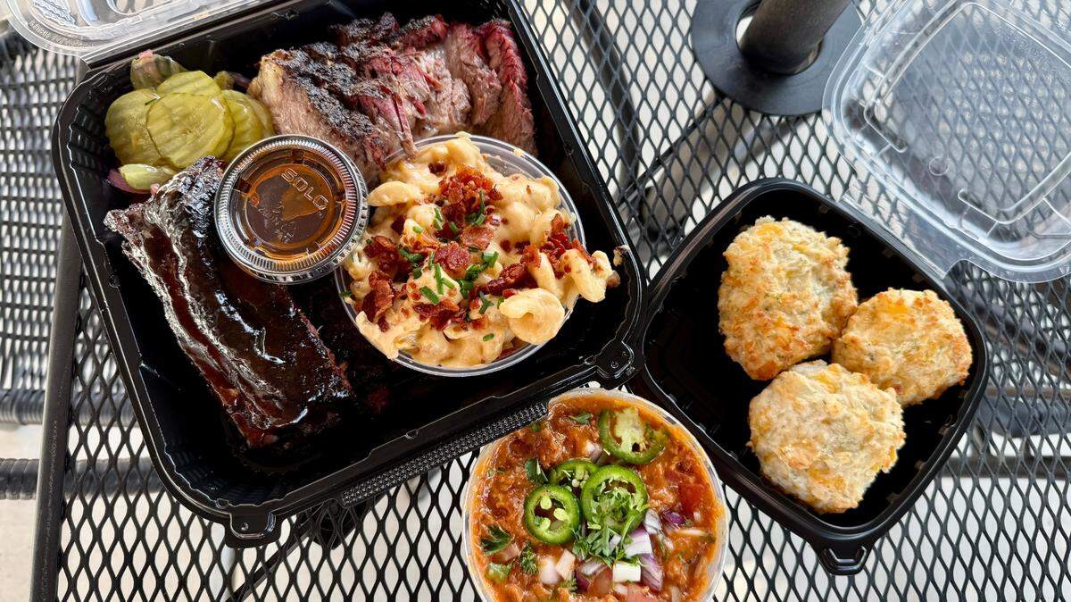 A pork ribs and brisket platter with five-cheese macaroni, charro beans and garlic cheddar biscuits at Craft BBQ & Catering Co. on McHenry Avenue in Modesto, Calif.