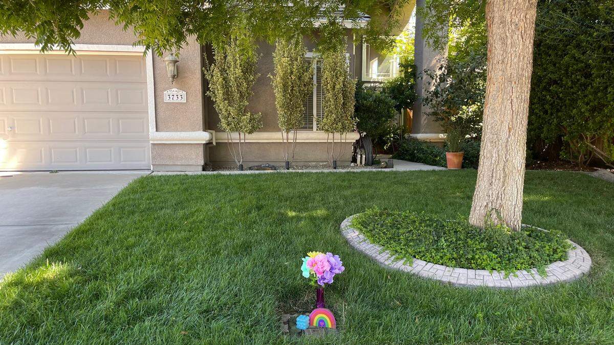 A memorial takes shape in the front yard of the Havenhurst Court home where a father is suspected of killing his daughter and then turning the gun on himself on July 12, 2023.