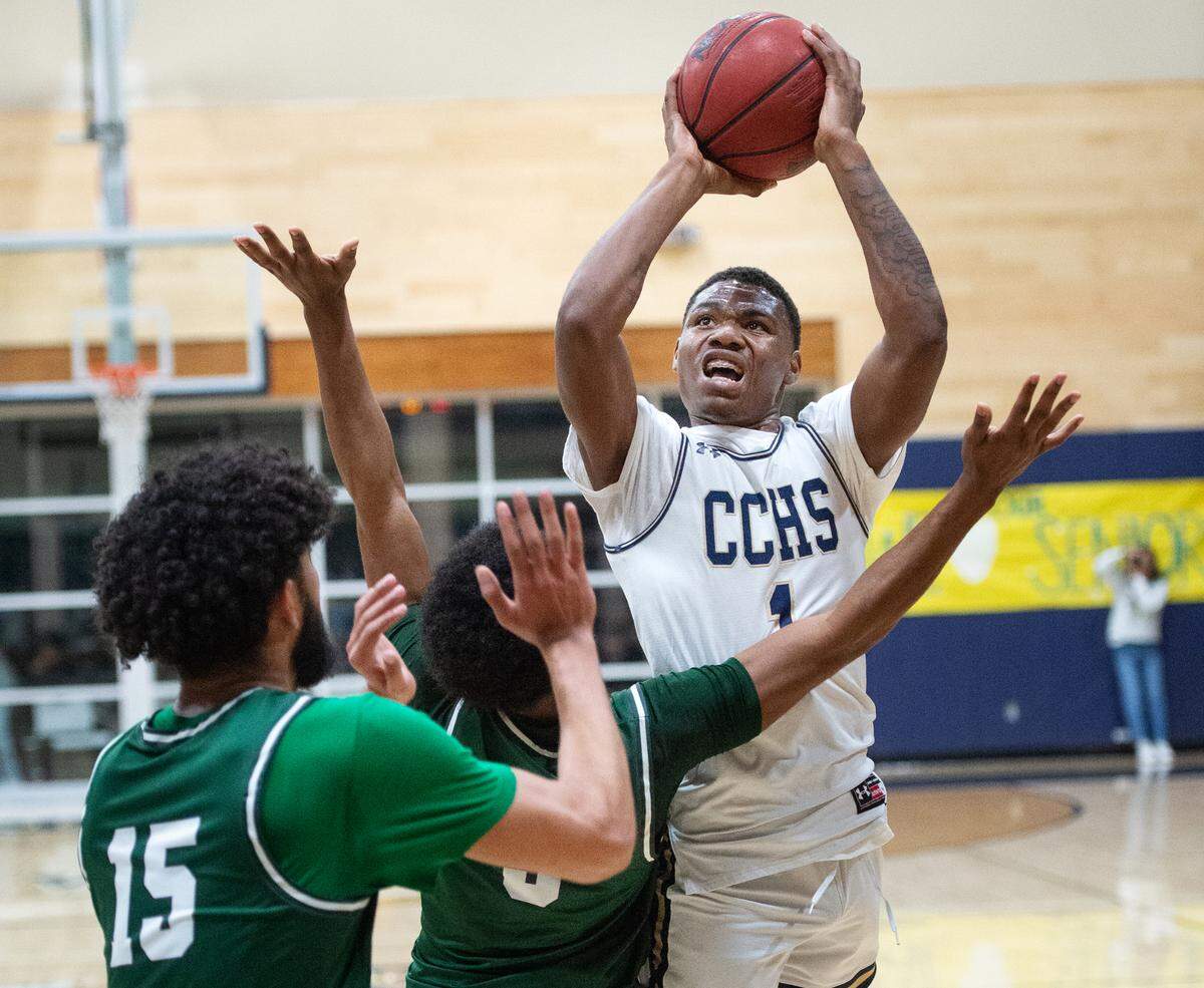 Central Catholic’s Malachi Miller shoots during a Valley Oak League game with Manteca at Central Catholic High School in Modesto, Calif., on Wednesday, Feb. 9, 2022. Manteca won the game 39-33.