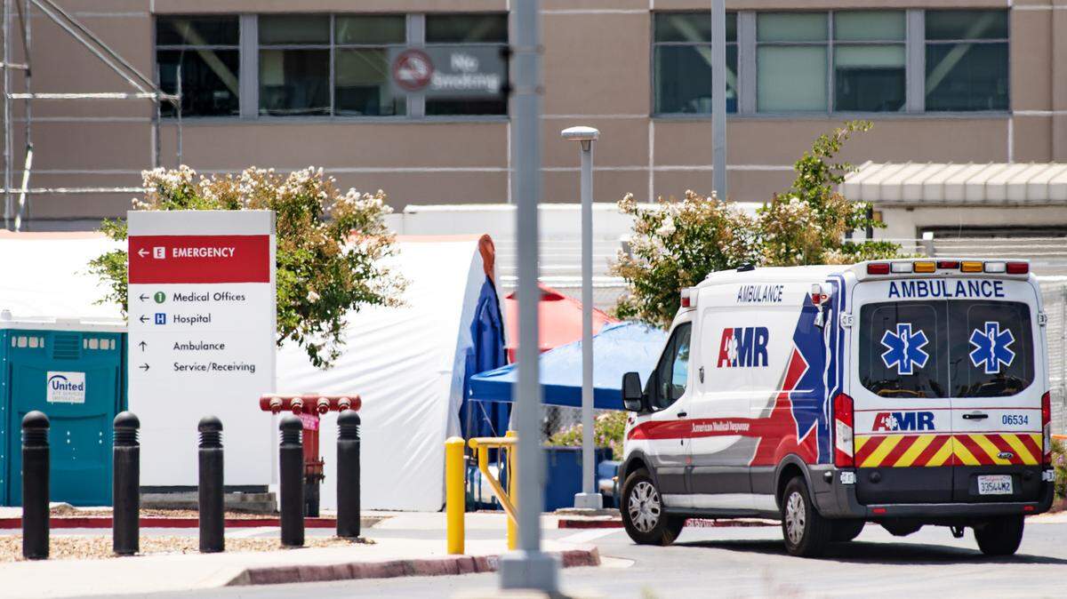 An ambulance pulls into the emergency department at Kaiser Medical Center in Modesto, Calif., on Tuesday, July 21, 2020.