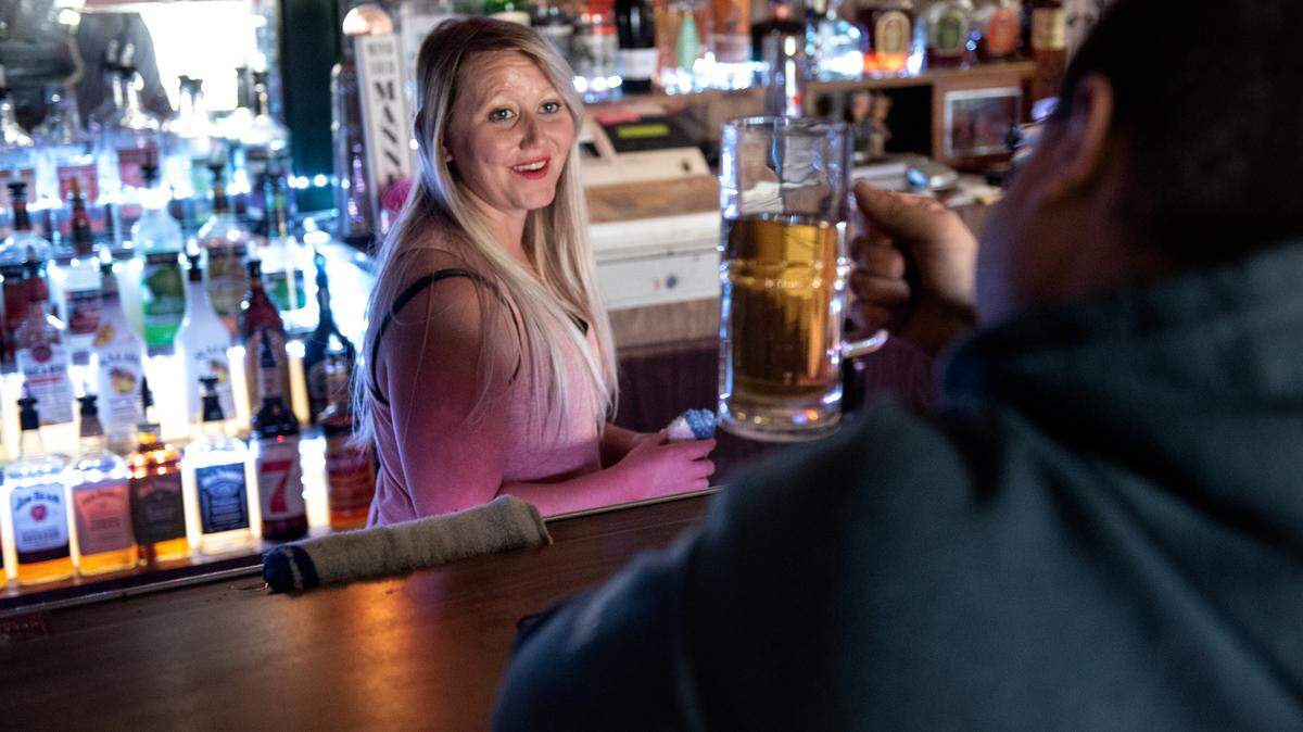 Bartender Cortney Bradshaw talks with customer Timothy Shaw at June Bug’s bar in Modesto, Calif., Wednesday, Nov. 2, 2022.