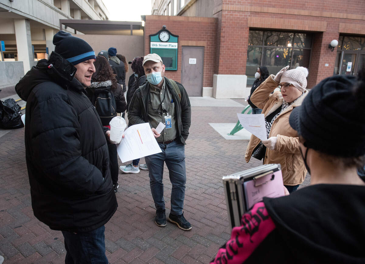 From the left, volunteers Damien Martinez, Joe Homer, Hilda Vega and Emily Owen prepare for the annual count of Stanislaus County’s homeless at 10th Street Place in Modesto, Calif., on Thursday, Feb. 24, 2022.