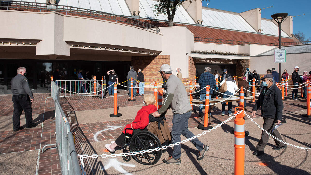 Stanislaus county residents wait in line for a COVID-19 vaccination at Modesto Centre Plaza in Modesto, Calif., on Thursday, Jan. 21, 2021.