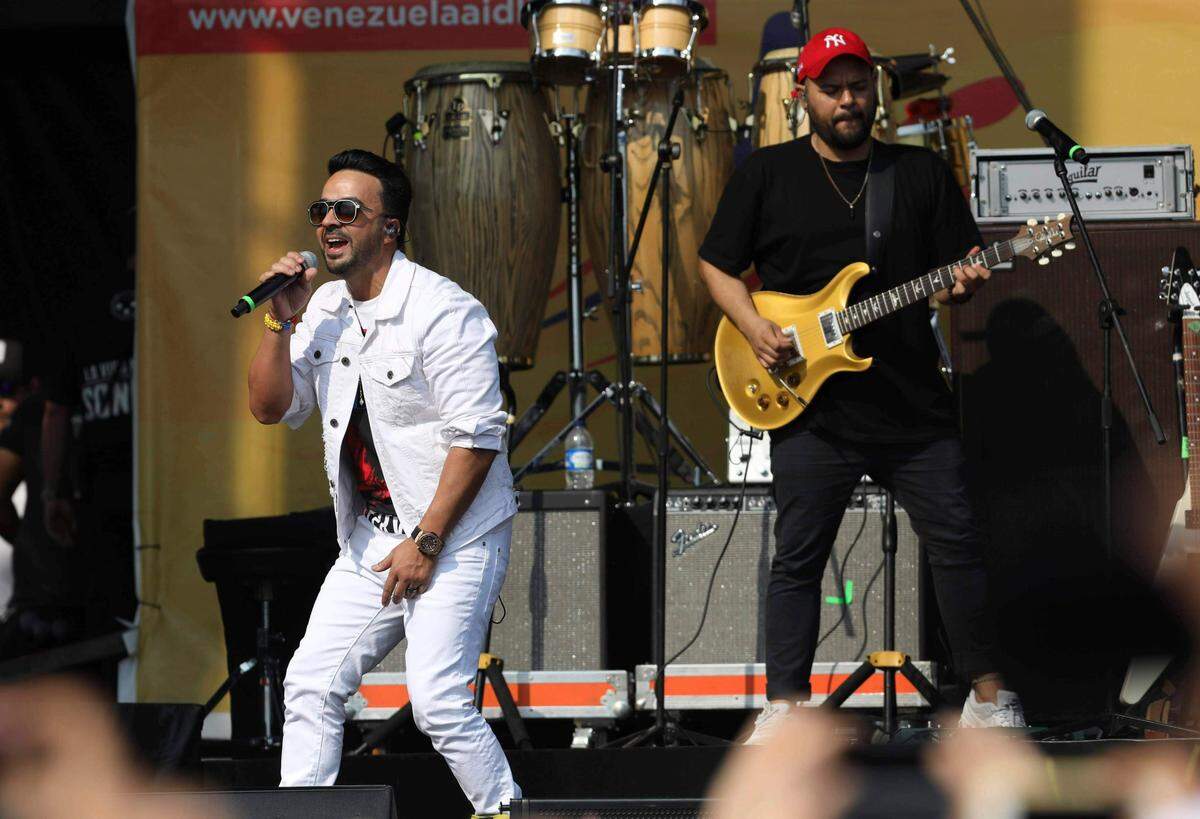 Luis Fonsi performs at the Venezuela Aid Live concert at the Tienditas International Bridge on the outskirts of Cucuta, Colombia, Friday, Feb. 22, 2019, on the border with Venezuela. British billionaire Richard Branson organized the mega concert, which features dozens of Latin musicians performing on a giant stage on one side of what Colombian authorities have renamed the “Unity” bridge. (AP Photo/Fernando Vergara)