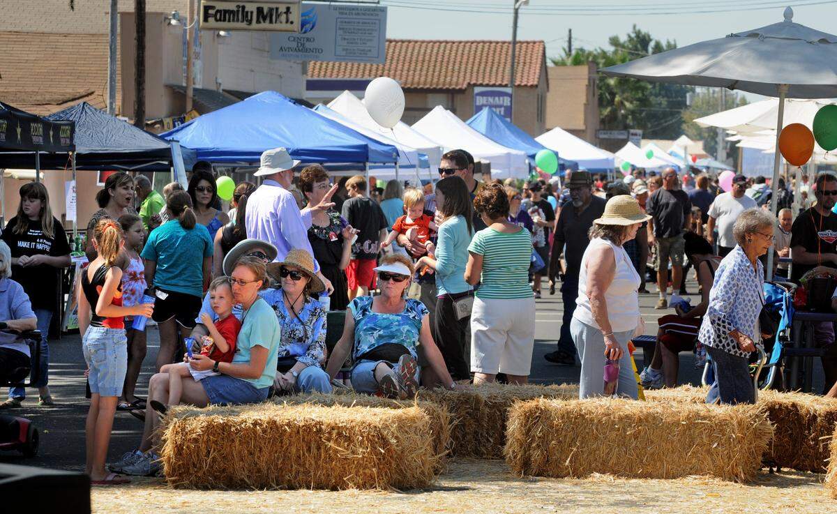 (BART AH YOU/bahyou@modbee.com)Denair hosted their Farm and Family Festival, Saturday.  Families, locals and visitors sit on hay bails waiting for the next stage performance.September 17, 2011
