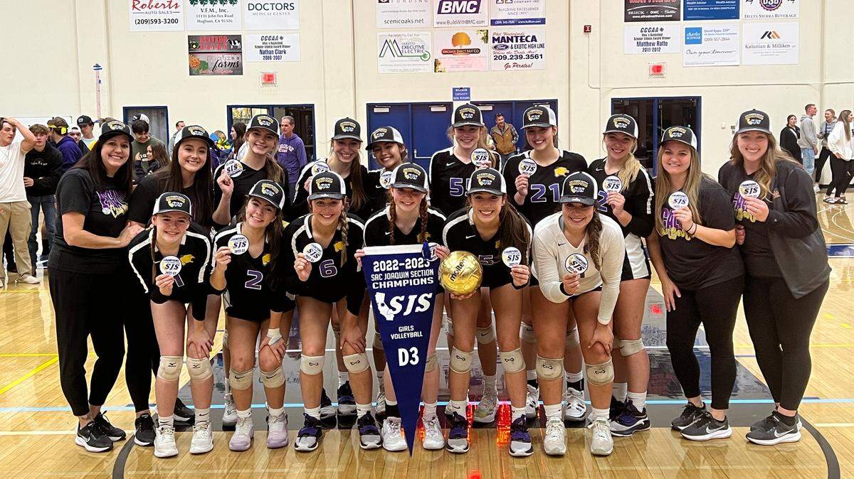 Escalon High players and coaches celebrate winning the Sac-Joaquin Section Division III volleyball championship at Modesto Junior College on Saturday, Nov. 5, 2022. The Cougars defeated Christian Brothers, 3-2.