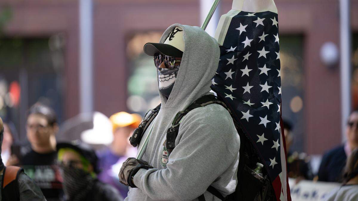 A few protesters were detained by Modesto police, at least one for allegedly wearing a mask with an intent to commit a crime, during a rally at Tenth Street Plaza in Modesto on Saturday, June 14, 2025.