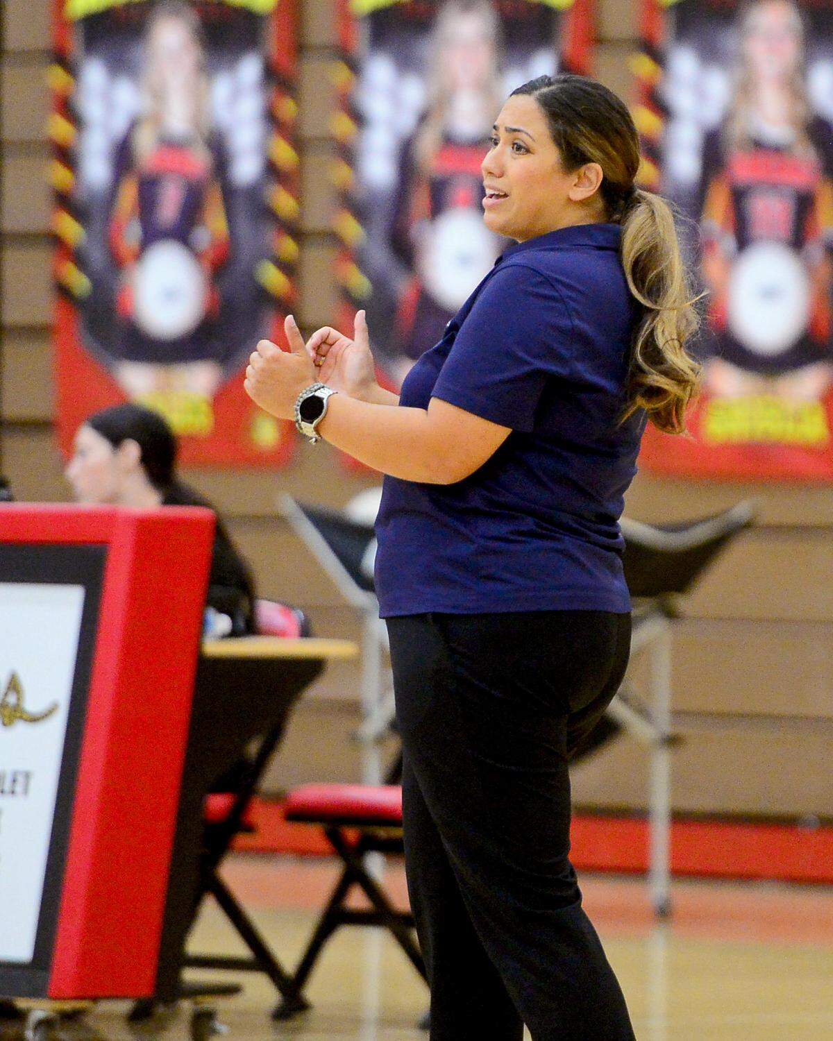 Central Catholic volleyball head coach Michelle Springmeyer talks to her players during a game between Oakdale and Central Catholic at Oakdale High School in Oakdale, Calif. on Thursday, Oct. 17, 2024.&nbsp;