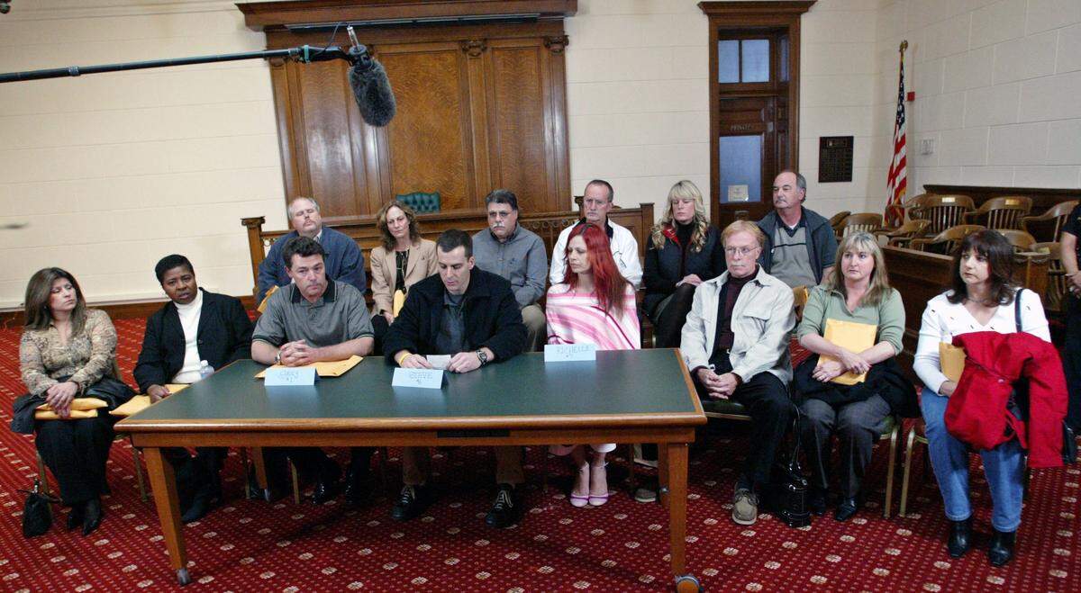 Members of the jury are seen as they read a statement during a news conferece in Redwood City, Calif., Monday, Dec. 13, 2004. The jury returned with a sentence recommendation of death in the penalty phase of the Scott Peterson case. Peterson was convicted of two counts of murder in the deaths of his wife Laci Peterson and their unborn child. Seen are, from left to right in the front row, Lorena Gonzalez, Fairy Sorrell, Greg Beraltis, Steve Cardosi, Richelle Nice, Dennis Lear, Mary Mylett and an unidentified alternate. Seen in the back row are John Guinasso, Julie Zanartu, Tom Marino, an unidentified alternate, Kristy Lamore and Michael Belmessieri.