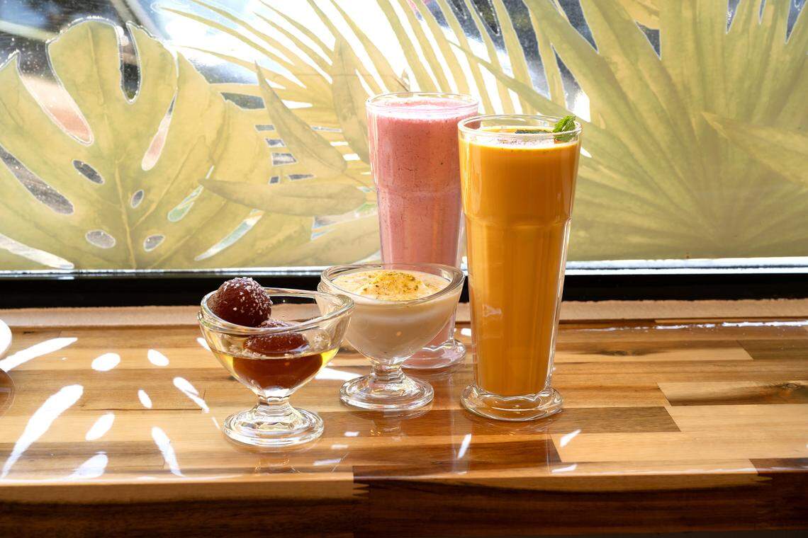 Desserts Gulab Jamun (dumplings made of thickened milk in syrup) and Rasmalai (spongy ras in malai cream) with mango and strawberry lassi (yogurt and fruit) at Tandoori Flame restaurant on 10th Street in Modesto, Calif., Wednesday, Sept. 27, 2023. The desserts Gulab Jamun (dumplings made of thickened milk in syrup) and Rasmalai (spongy ras in malai cream) with mango and strawberry lassi (yogurt and fruit).