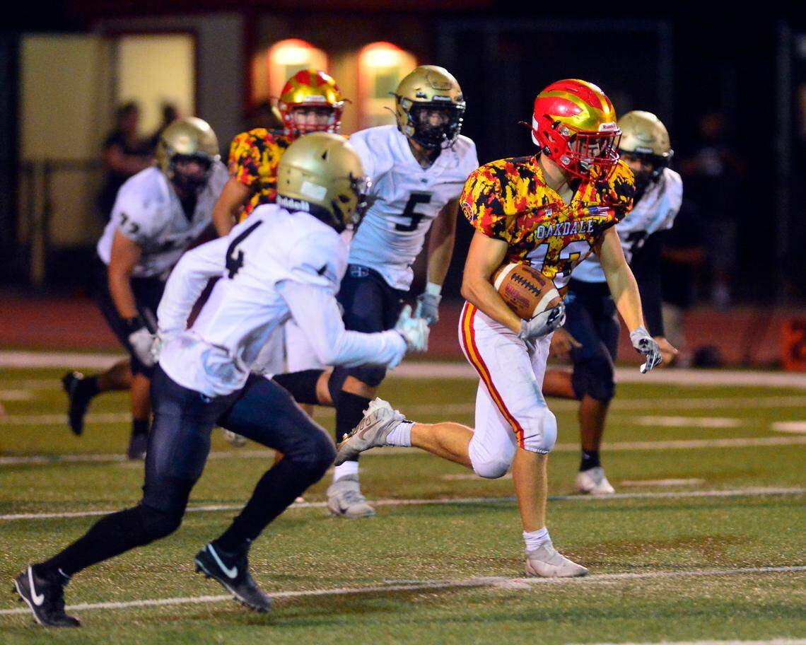 Oakdale running back Kevin Camelin (13) races upfield during a football game between Oakdale High School and Archbishop Mitty High School at Oakdale High School in Oakdale California on September 10, 2021.