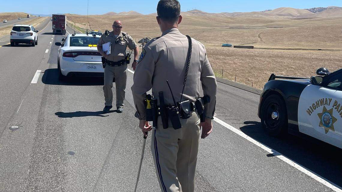 CHP officers investigate a roll-over crash on May 13, 2022. The crash killed an Oregon woman and injured a girl who was riding in the passenger seat.