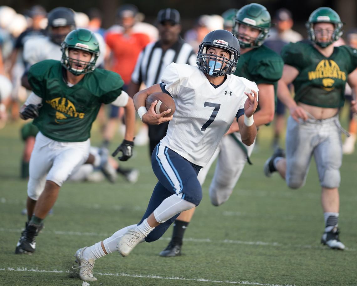 Downey’s John Sousa breaks free for a gain during a preseason scrimmage with Sonora at Downey High School in Modesto, Calif., Friday, August 10, 2018. 