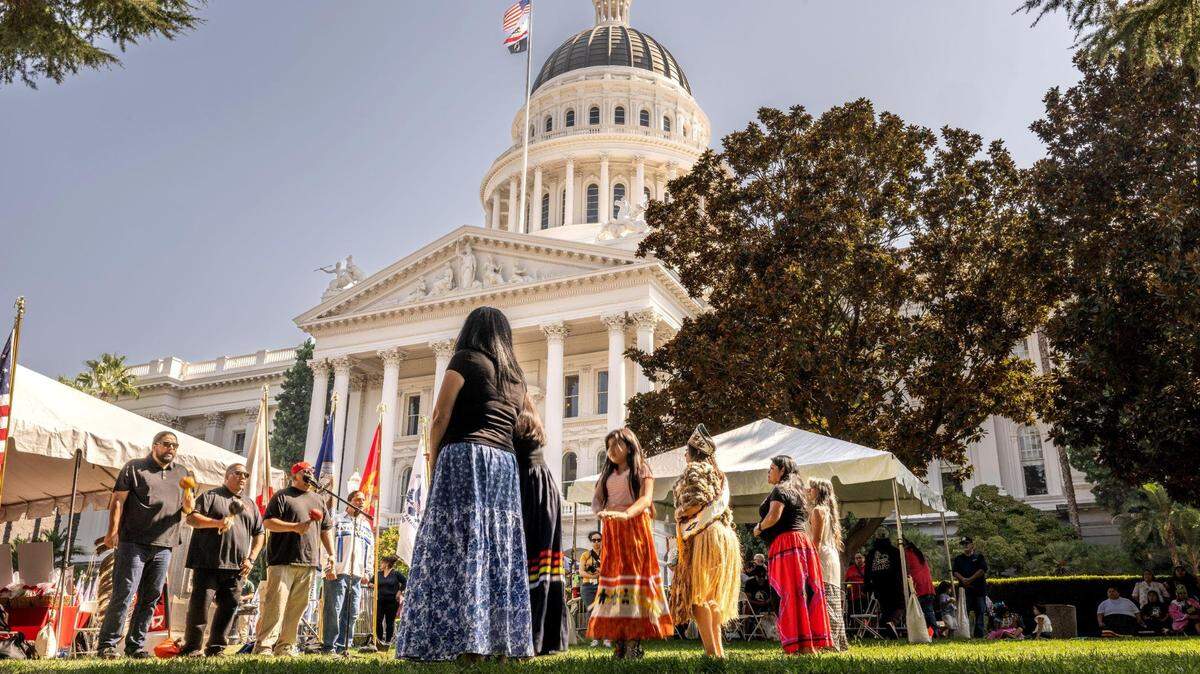 Intertribal Dance Singers and dancers perform during the California Native American Nations 56th Annual Native American Day at the State Capitol in 2023.