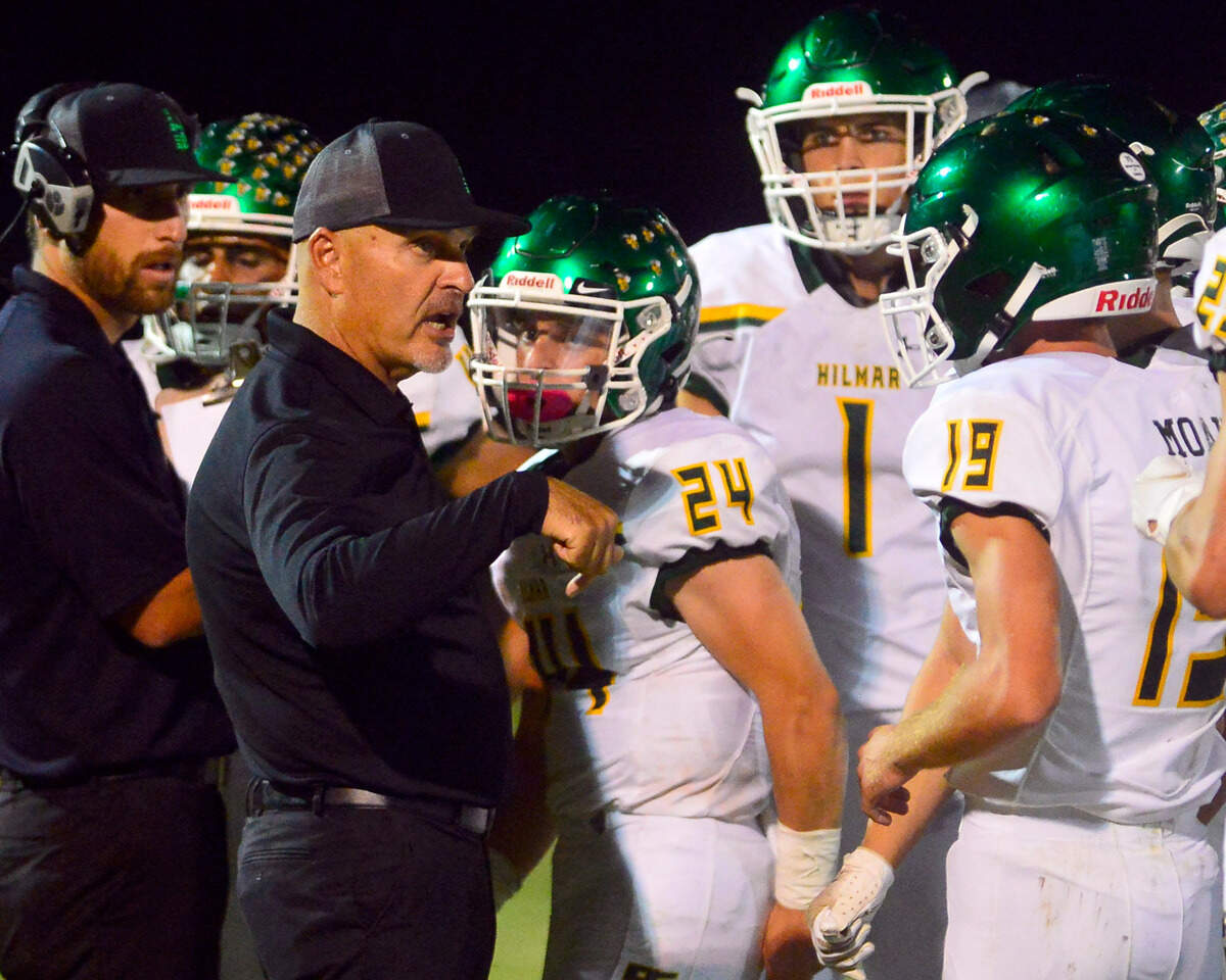 Hilmar Head Coach Frank Marques talks to his players during a timeout during a football game between Hilmar and Ripon High School at Ripon High School in Ripon CA on September 24, 2021
