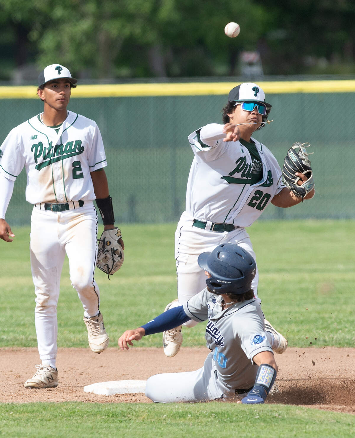 Pitman second baseman Marcus Perez forces out Downey’s Camden Rush during the Central California Athletic League game at Pitman High School in Turlock, Calif., Tuesday, May 2, 2023.