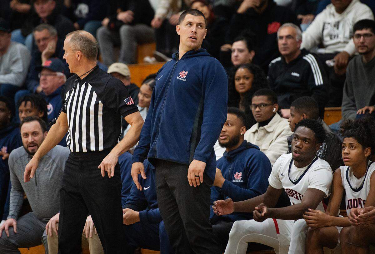 Modesto Christian coach Brice Fantazia looks at the clock in the fourth quarter during the Sac-Joaquin Section Division I playoff game with Lincoln at Modesto Christian High School in Salida, Calif., Friday, Feb. 17, 2023.