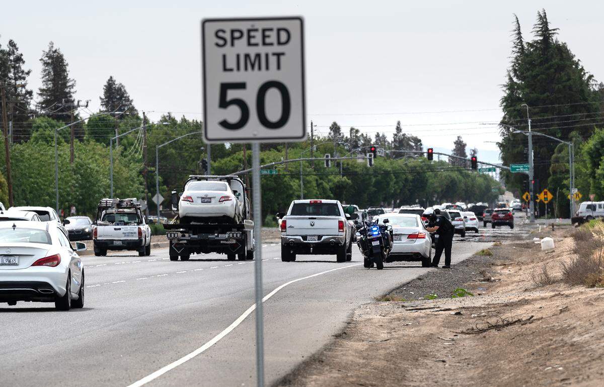 Modesto Police officer Ryan Olson cites a driver for speeding on Pelandale Road in Modesto, Calif., on Thursday, May 5, 2022. The California Office of Traffic Safety ranked Modesto worst among its peer cities for traffic crashes. The ranking is for 2019, which is the latest year for which OTS has statistics, and places Modesto first among 59 California cities with 100,000 to 250,000 residents. Modesto’s population is about 220,000 residents.