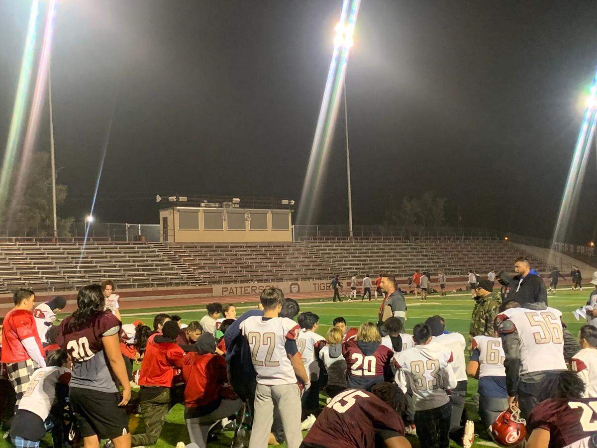 Patterson High School football coach Rob Cozart addresses his team after practice on Monday, Nov. 15, 2021