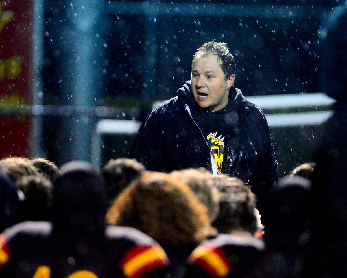 Oakdale Head Coach Garrett Martin addresses his team after a 2024 CIF Sac-Joaquin Section Division 3 playoff game between Oakdale High School and Destiny Christian Academy at Oakdale High School in Oakdale California on November 22, 2024. Oakdale won the game 49-35.