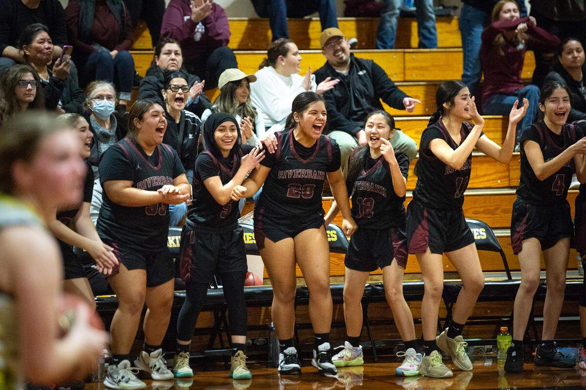 Riverbank players celebrate their Trans-Valley League victory over Hughson in Hughson, Calif., Tuesday, Jan. 31, 2023. Riverbank won the game 53-41.