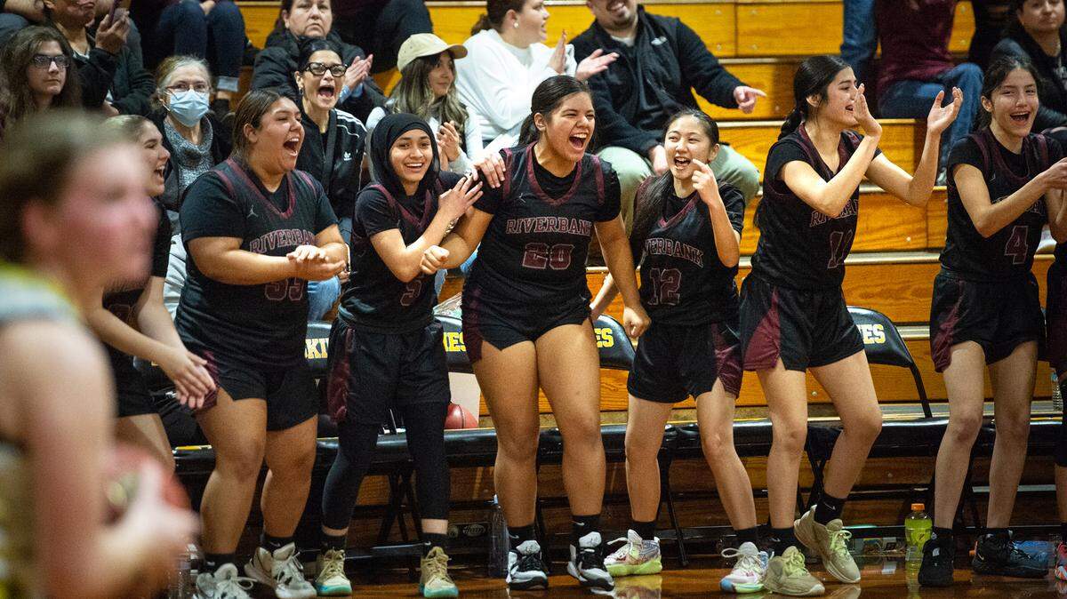 Riverbank players celebrate their Trans-Valley League victory over Hughson in Hughson, Calif., Tuesday, Jan. 31, 2023. Riverbank won the game 53-41.