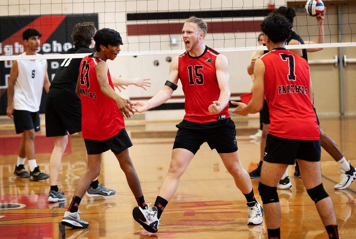 Modesto’s Cole Rogers (15) celebrates a kill shot with teammates Pranauv Vijaykumar, left, and Sergio Rodriguez during the Central California Athletic League match in Modesto, Calif., Thursday, April 27, 2023. Modesto won the match 3-2.