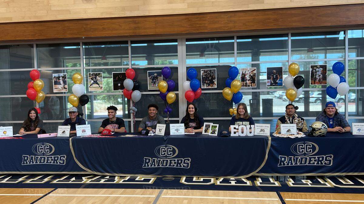 Central Catholic student athletes Noelany Ramirez, Nolan Anderson, Elijah Robinson, Aiden Taylor, Abby Castillon, Romeo Eteaki and Jacob Edmond pose for a picture at the Next Level Ceremony on May 18, 2022.