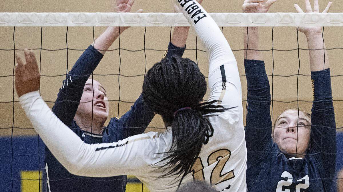 Enochs’ Amaka Okam puts the ball over Gregori defenders Morgan Andrews (22) and Sophia Franzia during the Central California Athletic League game at Gregori High School in Salida, Calif., Wednesday, Sept. 25, 2019.