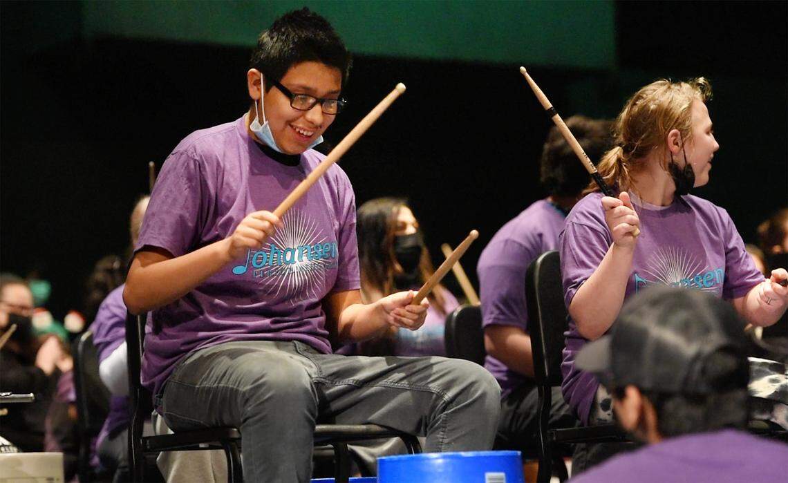 Special education student Christopher Hernandez, left, plays the drums with music and other special education students at Johansen High School collaborated to present a “Differently-Abled Drumline Celebration.” in Modesto, Calif., on Friday, Dec. 17, 2021.