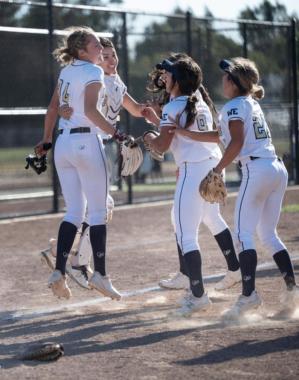 Central Catholic players celebrate their 2-1 victory over Oakdale in the Valley Oak League game at Central Catholic High School in Modesto, Calif., on Tuesday, May 10, 2022. Central Catholic won the game 2-1.