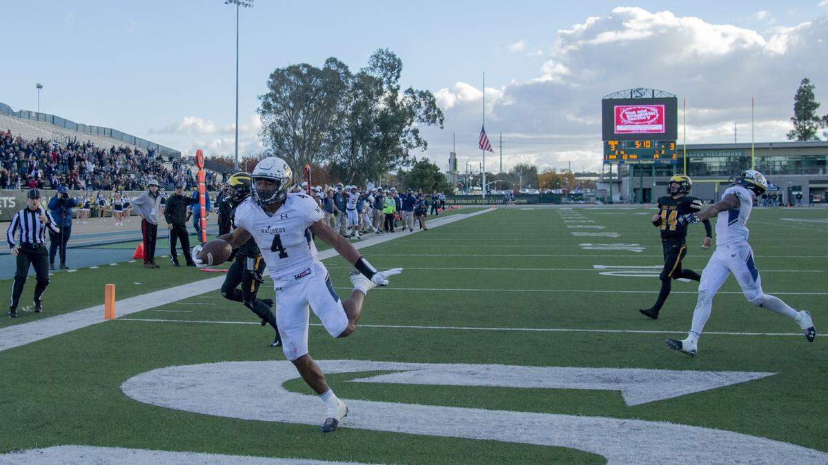 Raiders D’Angelo Bellamy (4) score from 19 yards out to give the Raiders a 10-3 lead in the second quarter in the Section football championship game between Del Oro vs. Central Catholic, at Sacramento State on Saturday, December 1, 2018.