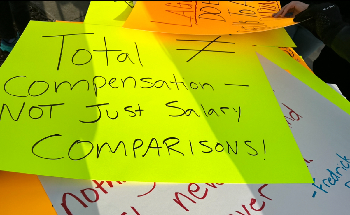 A stack of protest signs sits outside the Modesto City Schools Board of Education room on Monday, March 4, 2024. Teachers rallied outside the meeting before it started and packed the room when the board was in session.