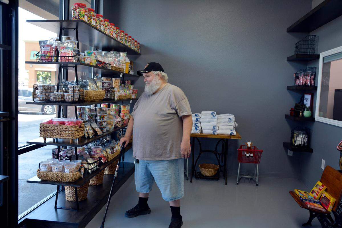 Hughson resident Craig Cornell checks out the offerings inside The Parched Goat, a new freeze-dried sweets and snack shop, July 12, 2023.