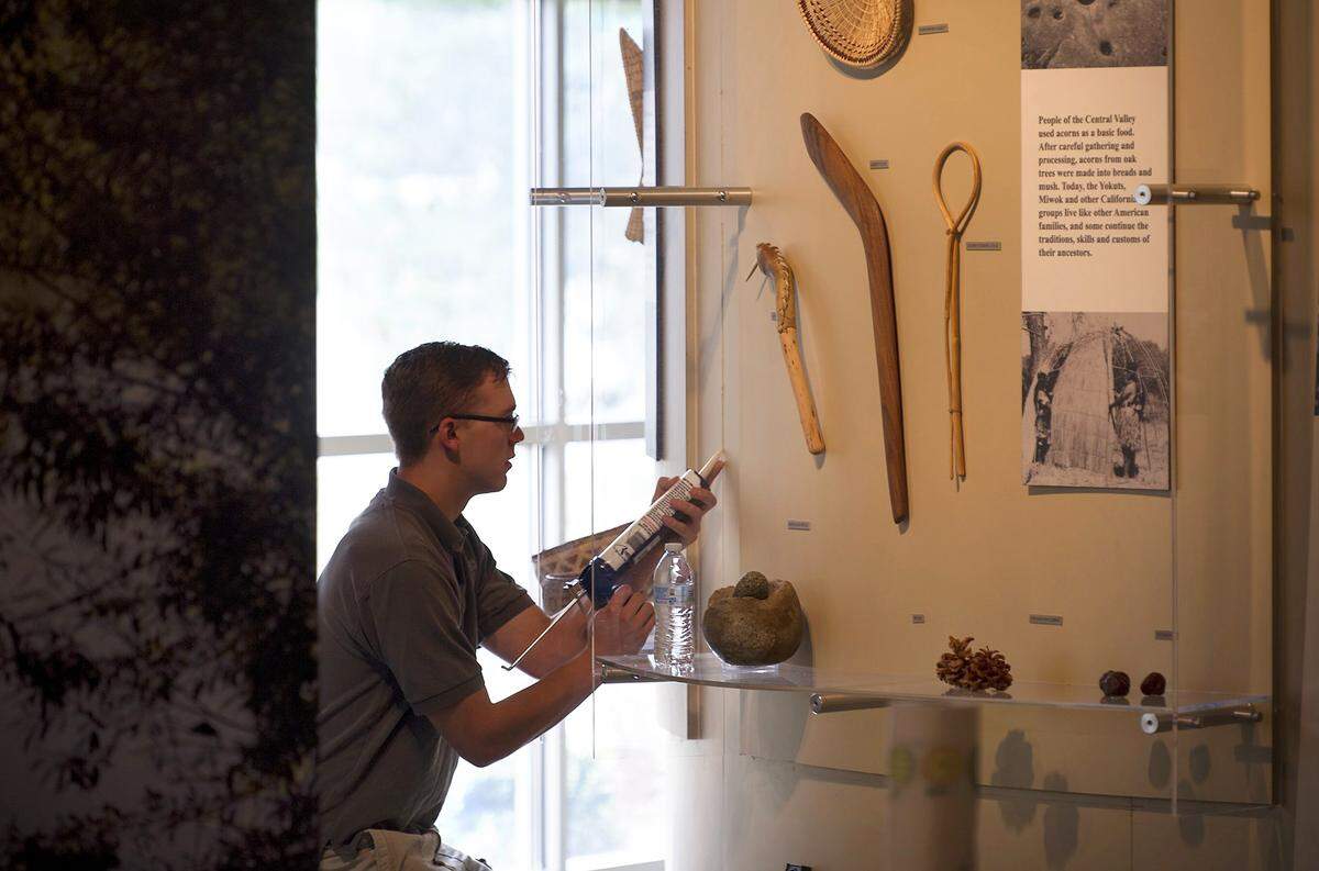 In this 2014 photo, Nick Borden works on exhibits in the Great Valley Museum, then under construction on the Modesto Junior College West Campus.